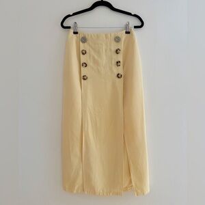 Pencil skirt w/ dbl breasted button detail & two slits.
